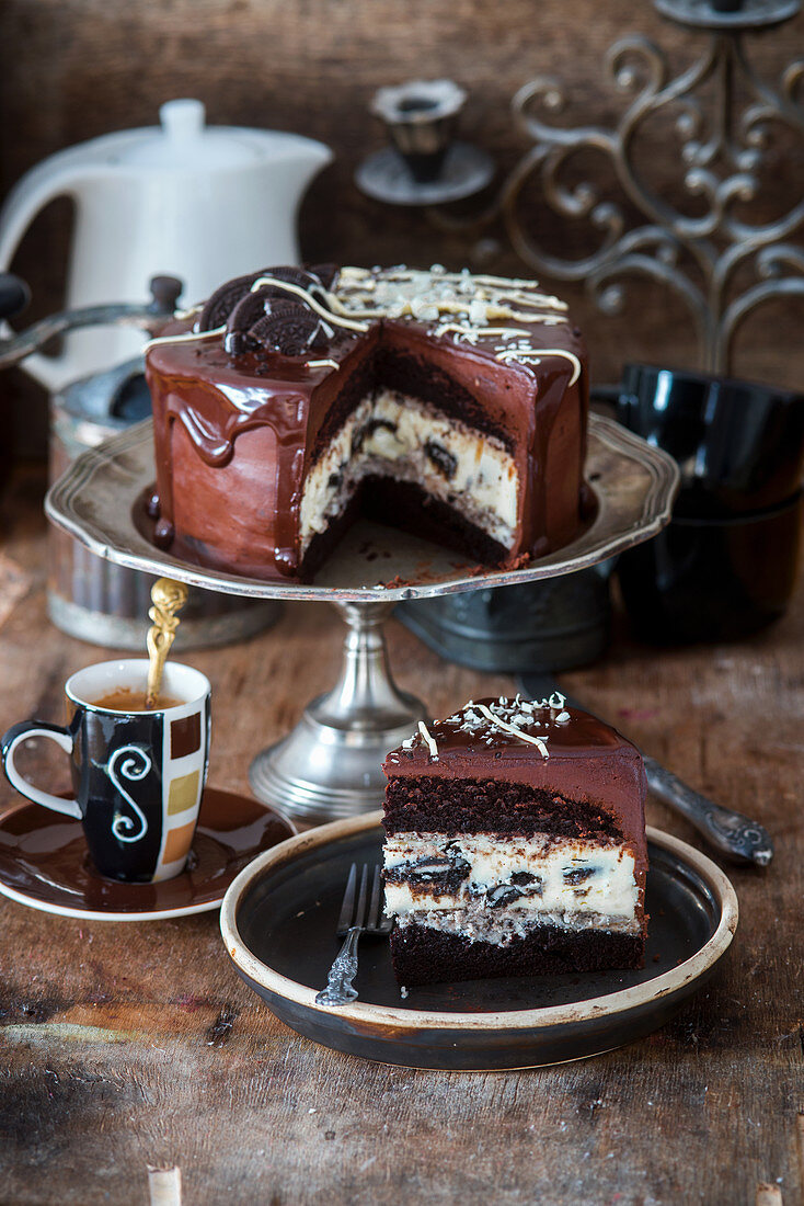 Chocolate cake with baked Oreo cheesecake and oreo cream
