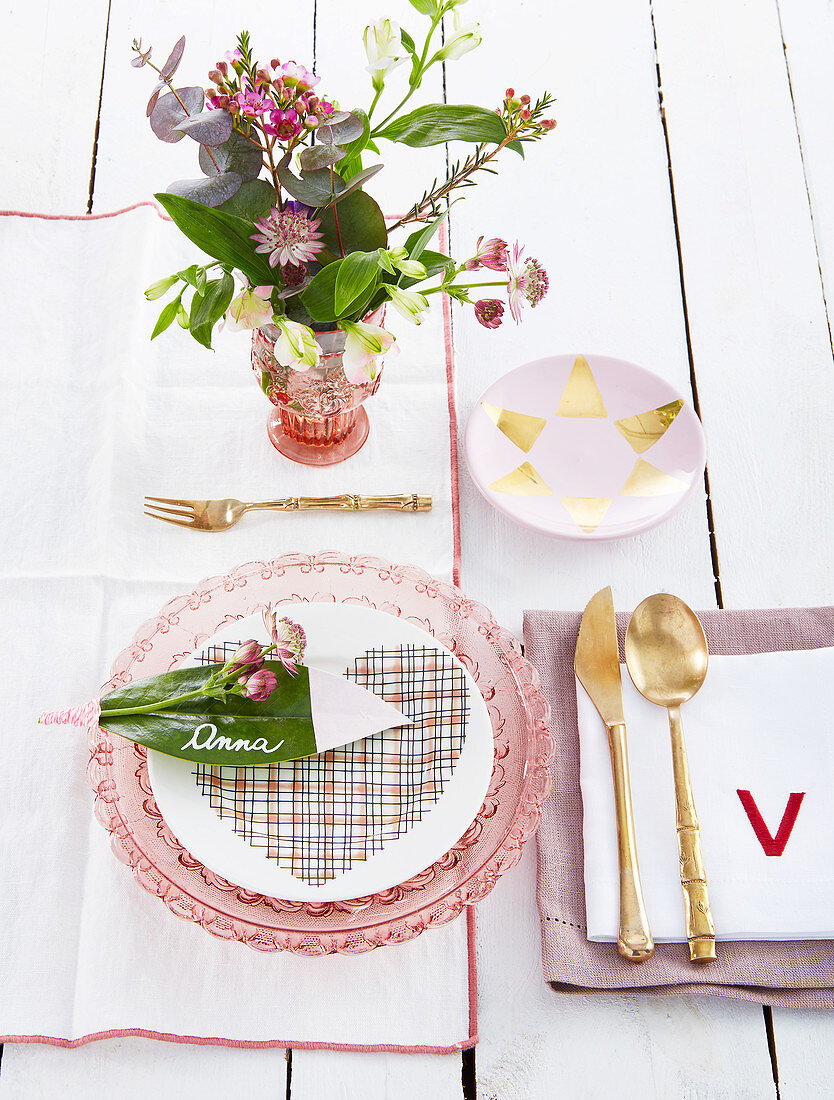 Leaf used as name tag on table set in pink