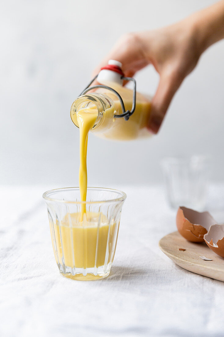 Egg nog being poured into a glass