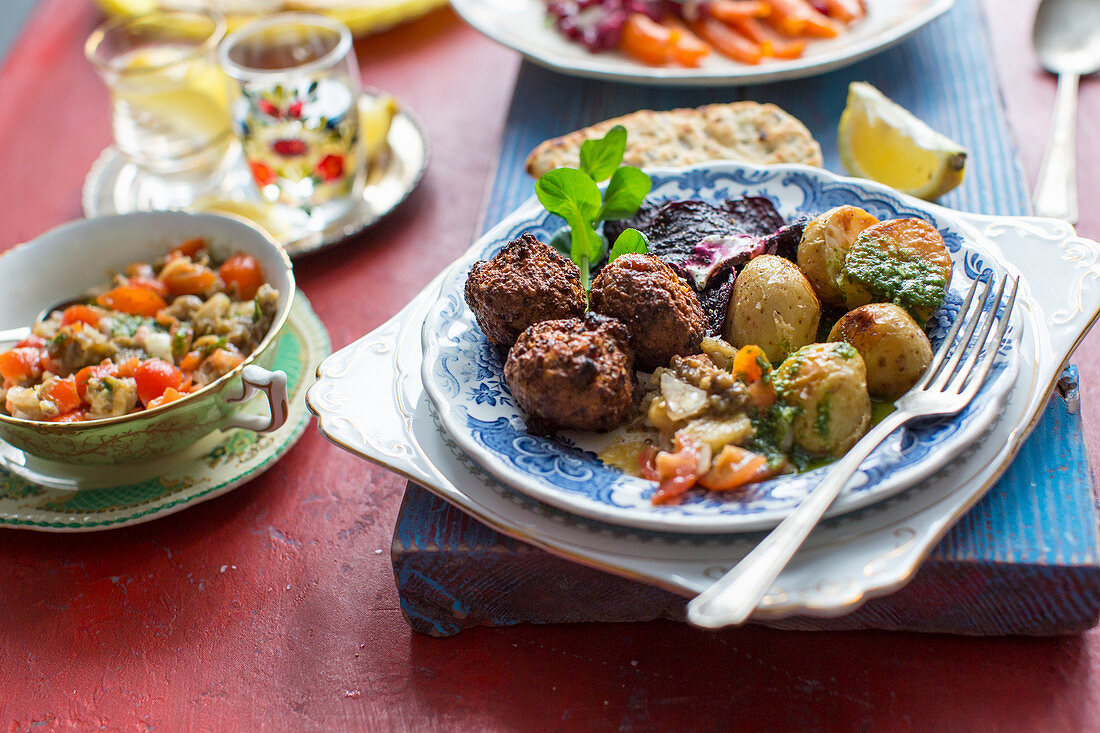 Middle easterrn supper with chickpea falafel, mutabal dip, roast potatoes and beetroot crips