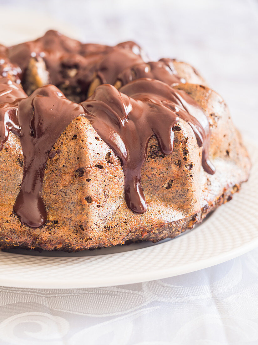 Flourless (almond flour) gluten and sugar free Easter gugelhupf cake with banana, poppy seeds and chocolate icing