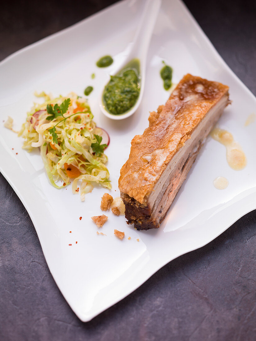 Roast pork and crackling with coleslaw and lettuce pesto