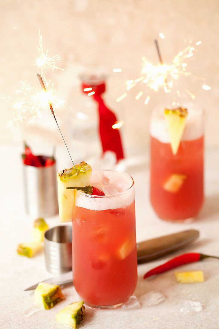 A chilli vodka cocktail with pineapple and sparklers
