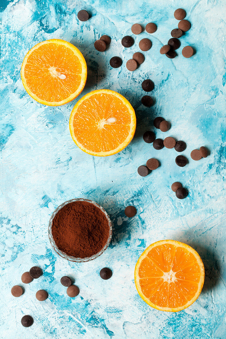 Oranges halves with chocolate chips and cocoa powder