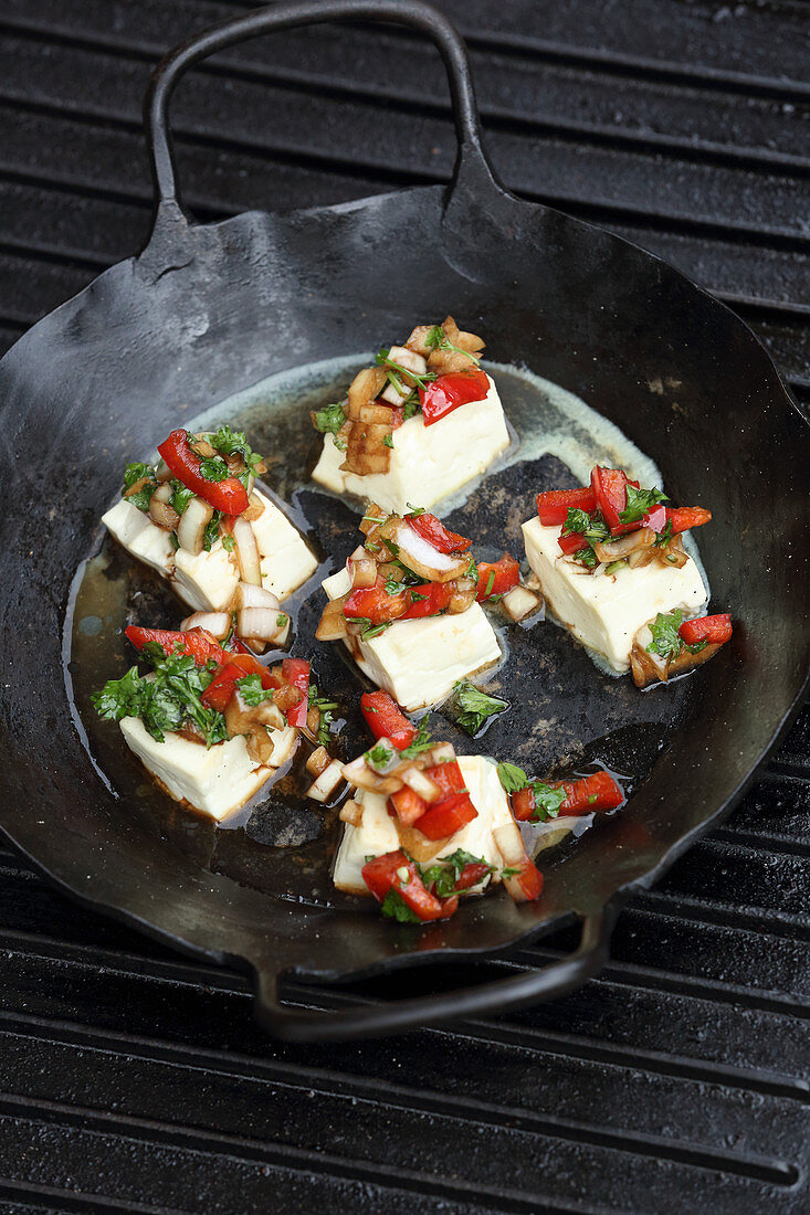 Oven-baked feta cheese with pepper salsa