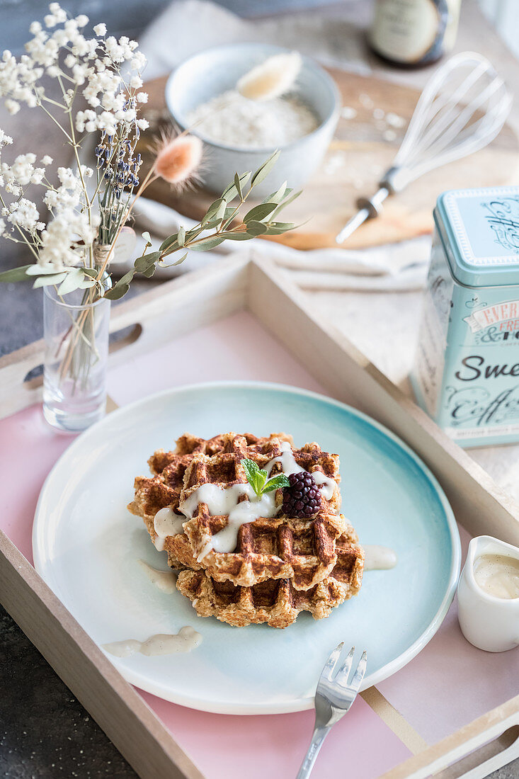 Wholemeal waffles with yoghurt sauce and blackberries