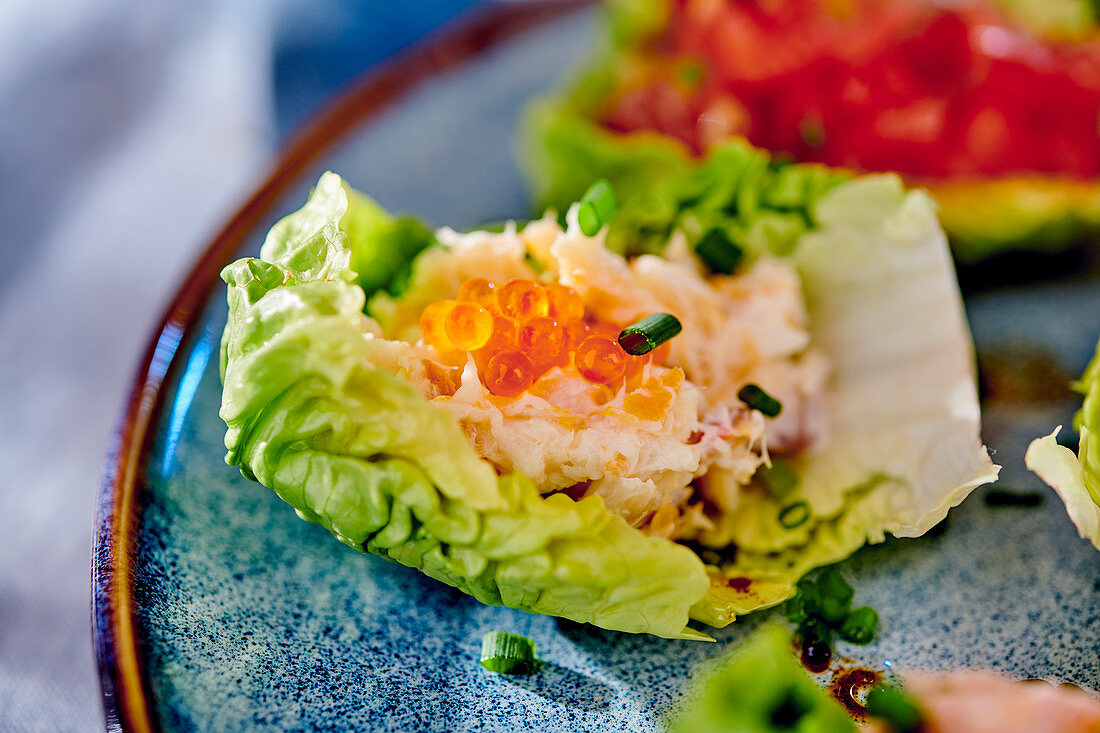 Rillette with fish and caviar in a lettuce leaf