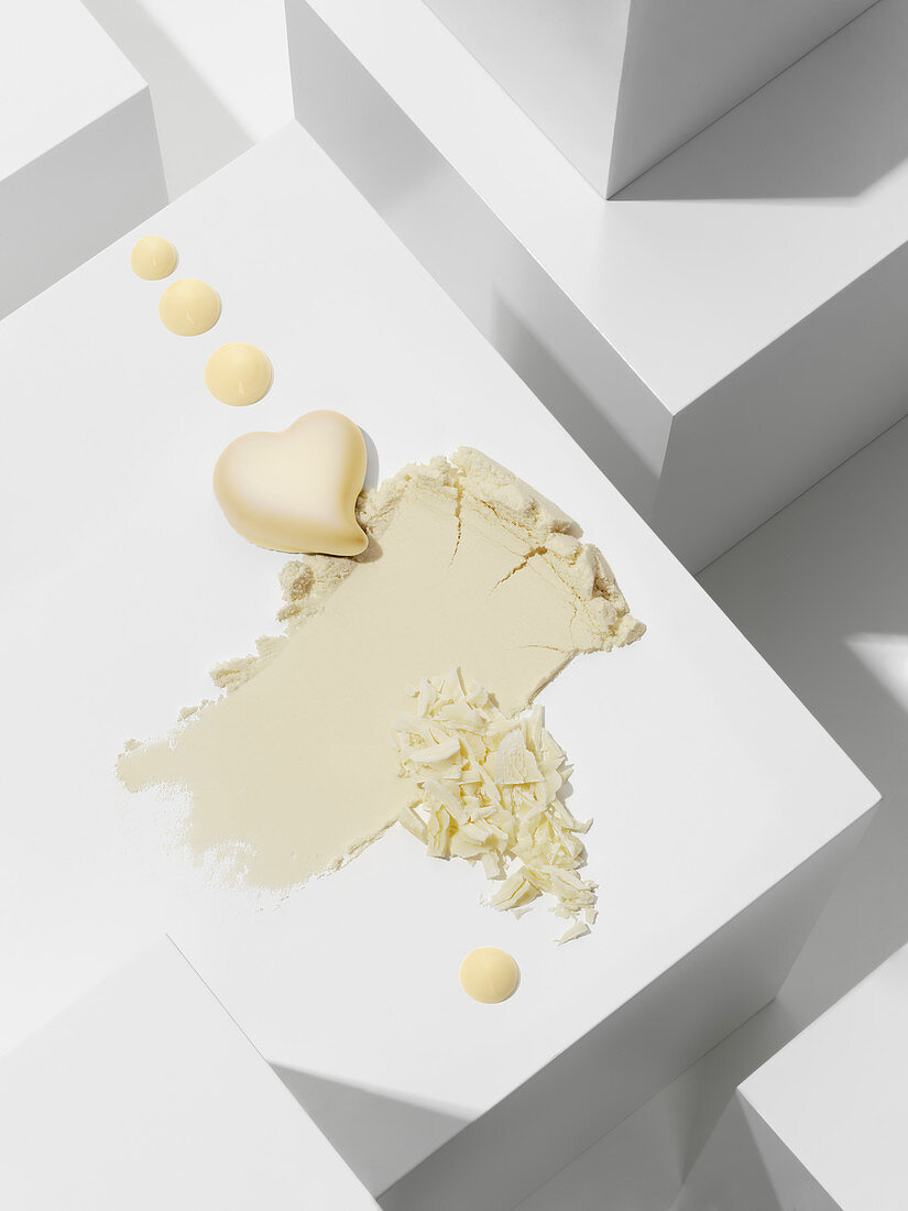 A white chocolate heart with various chocolate textures