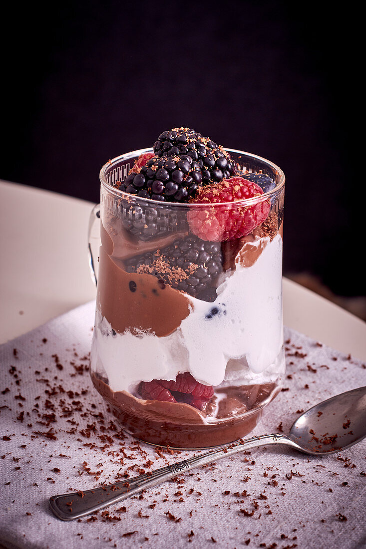 Berries with chocolate sauce and cream