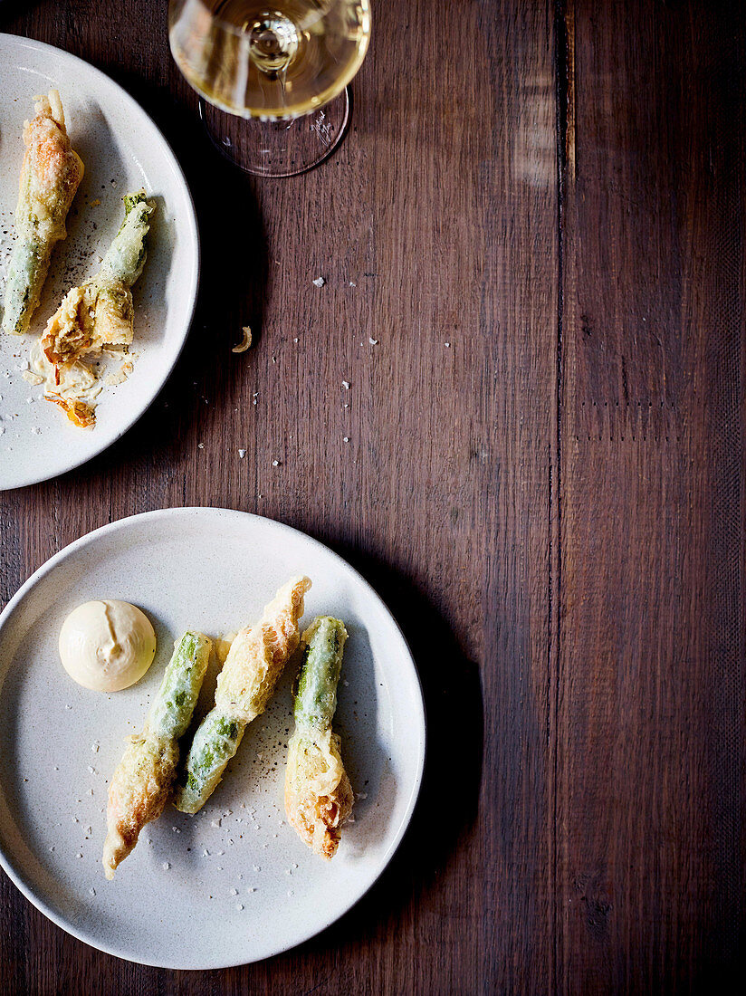 Fried and zucchini flowers stuffed with almond puree and Aioli