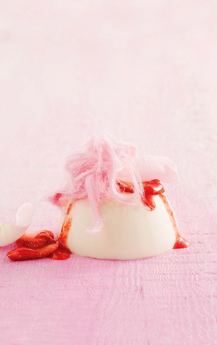 Rosewater panna cotta with strawberries and fairy floss
