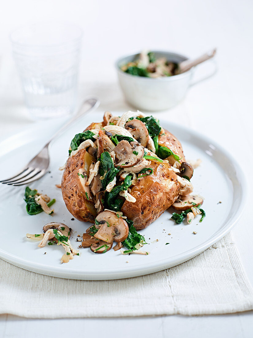 Baked potato with chicken, mushrooms and spinach