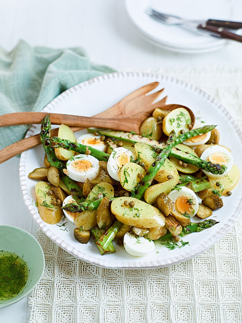 Potato salad with asparagus, eggs and gherkins