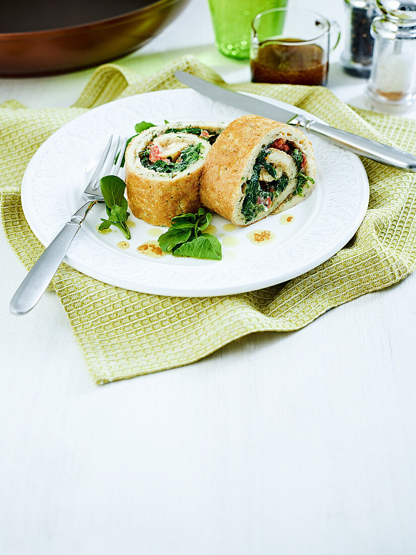 Pancake roulade filled with spinach and eggs