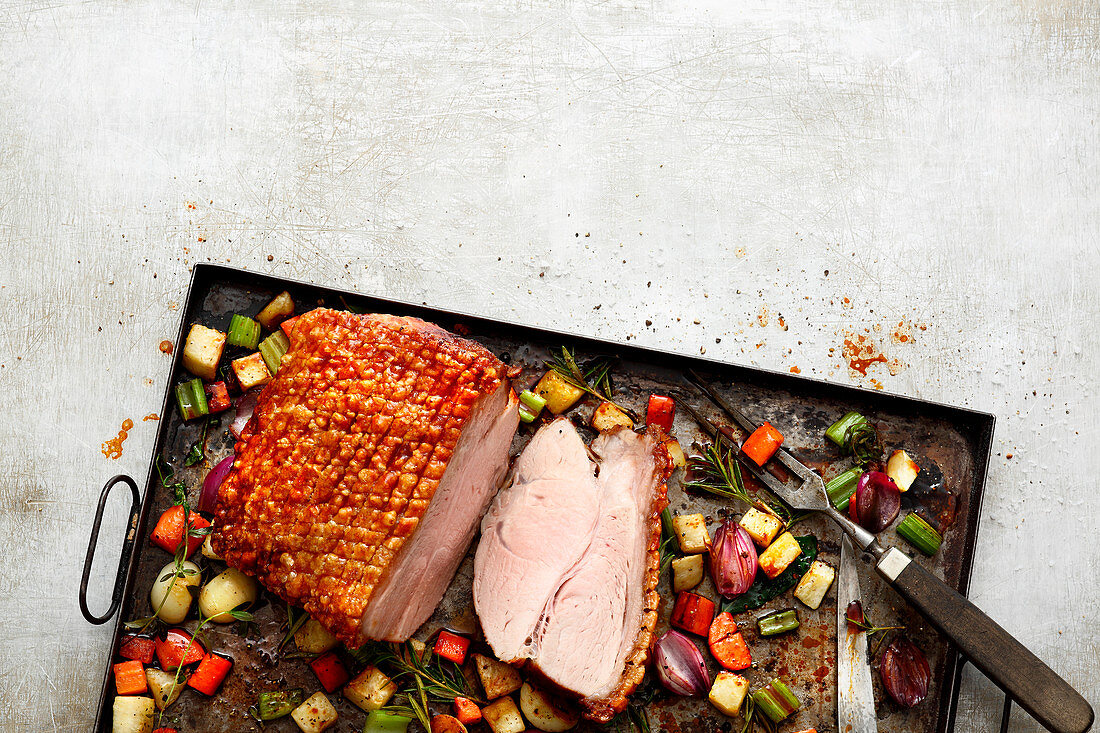 Roast pork with vegetables on a plate