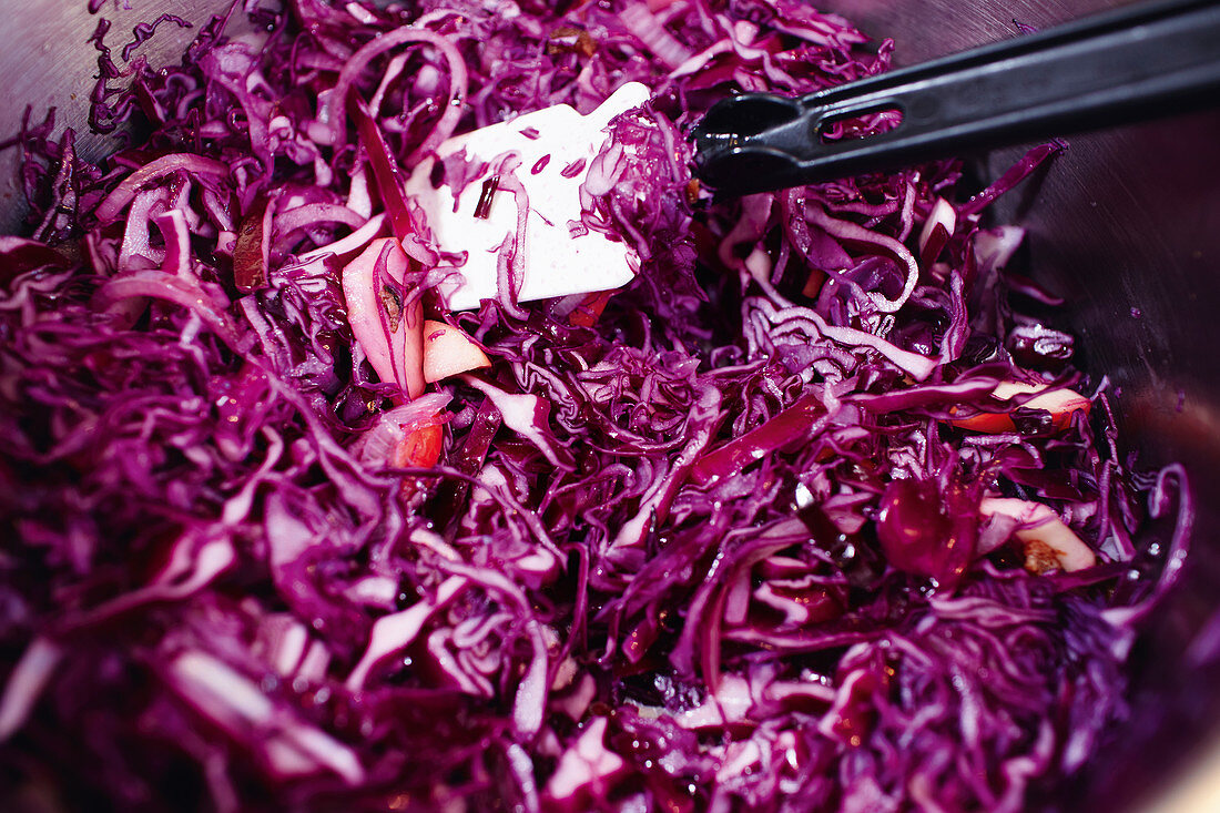 Red cabbage being mixed