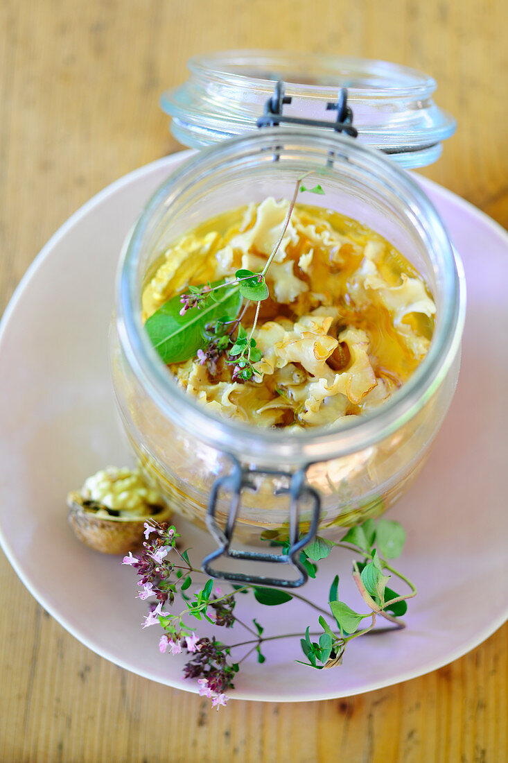 Pickled cauliflower mushrooms in a flip-top jar