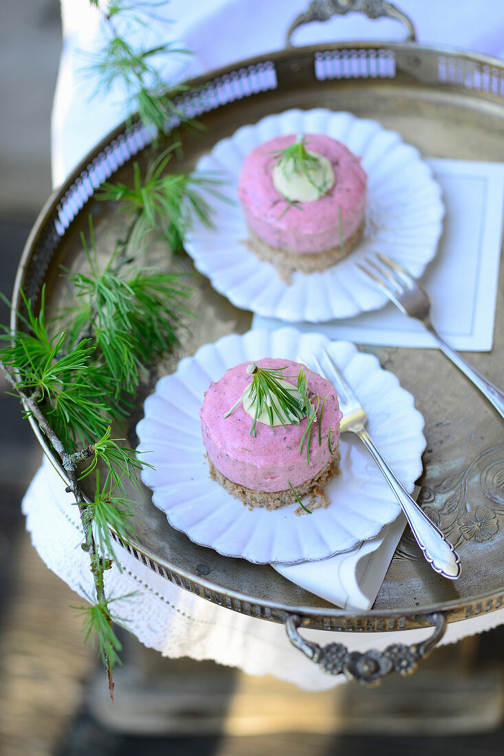 Two larch tartlets on a sliver tray