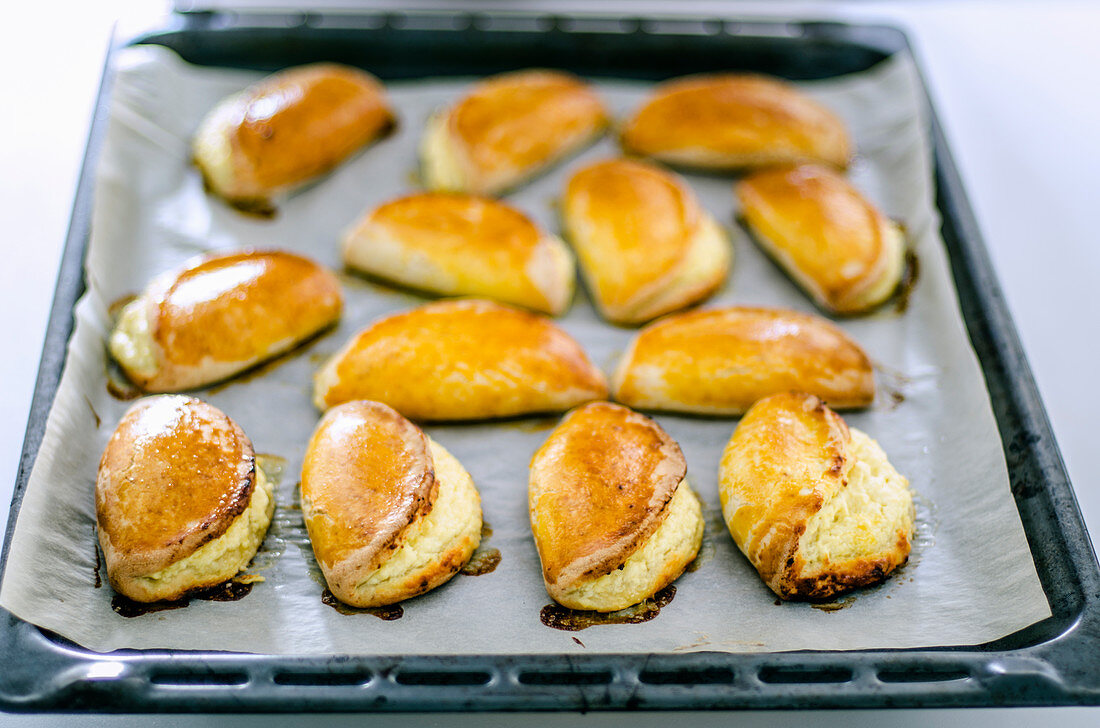 Freshly baked quark pastries in a baking tray