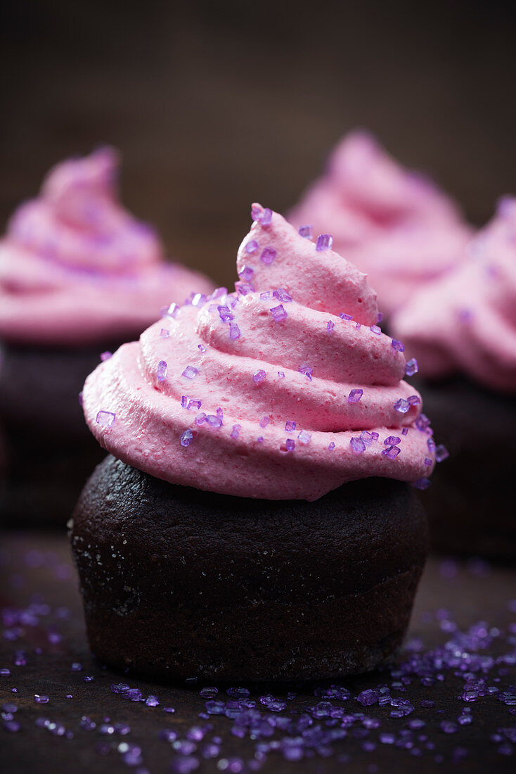 Vegan chocolate cupcakes with raspberry and marzipan cream