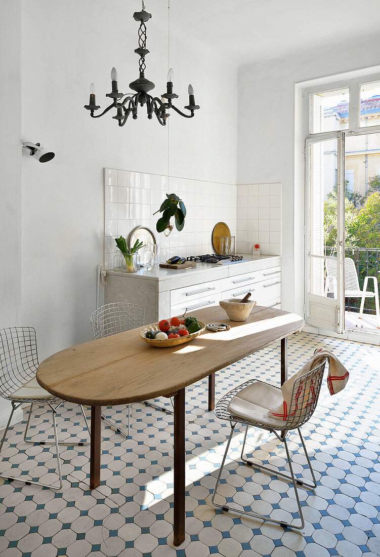 Classic tiled floor in Mediterranean kitchen-dining room