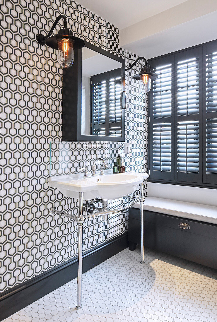 Patterned wall in classic black-and-white bathroom
