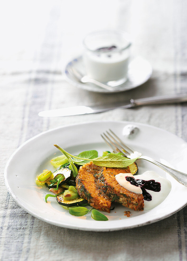 Roast barley wrapped in sage with a yoghurt sauce and vegetables