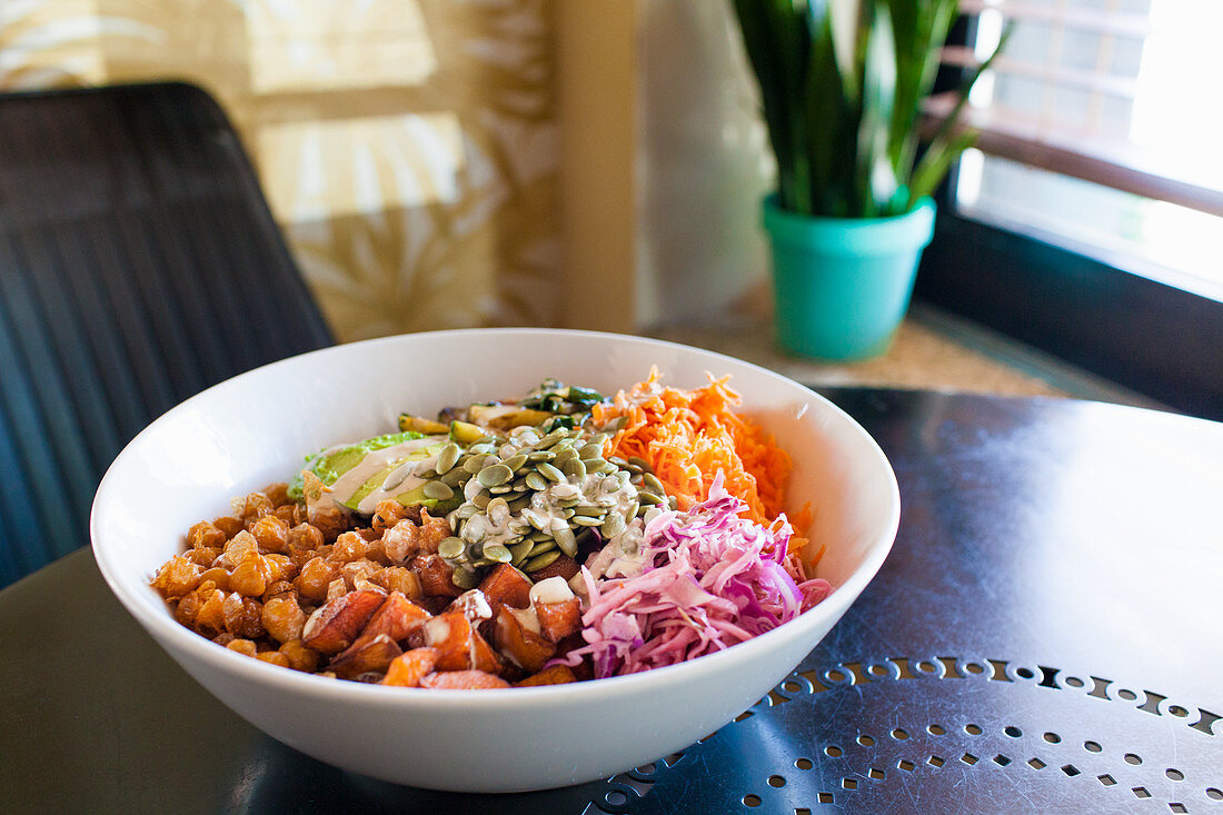 Vegan bowl with quinoa, buckwheat and tahini dressing