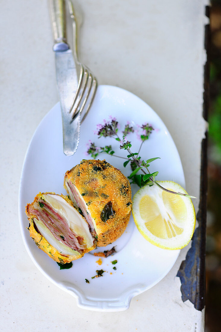 Baked birch bolete with ham and cheese