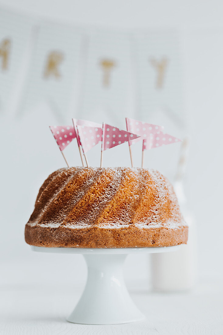 A classic Bundt cake decorated with flags for a party