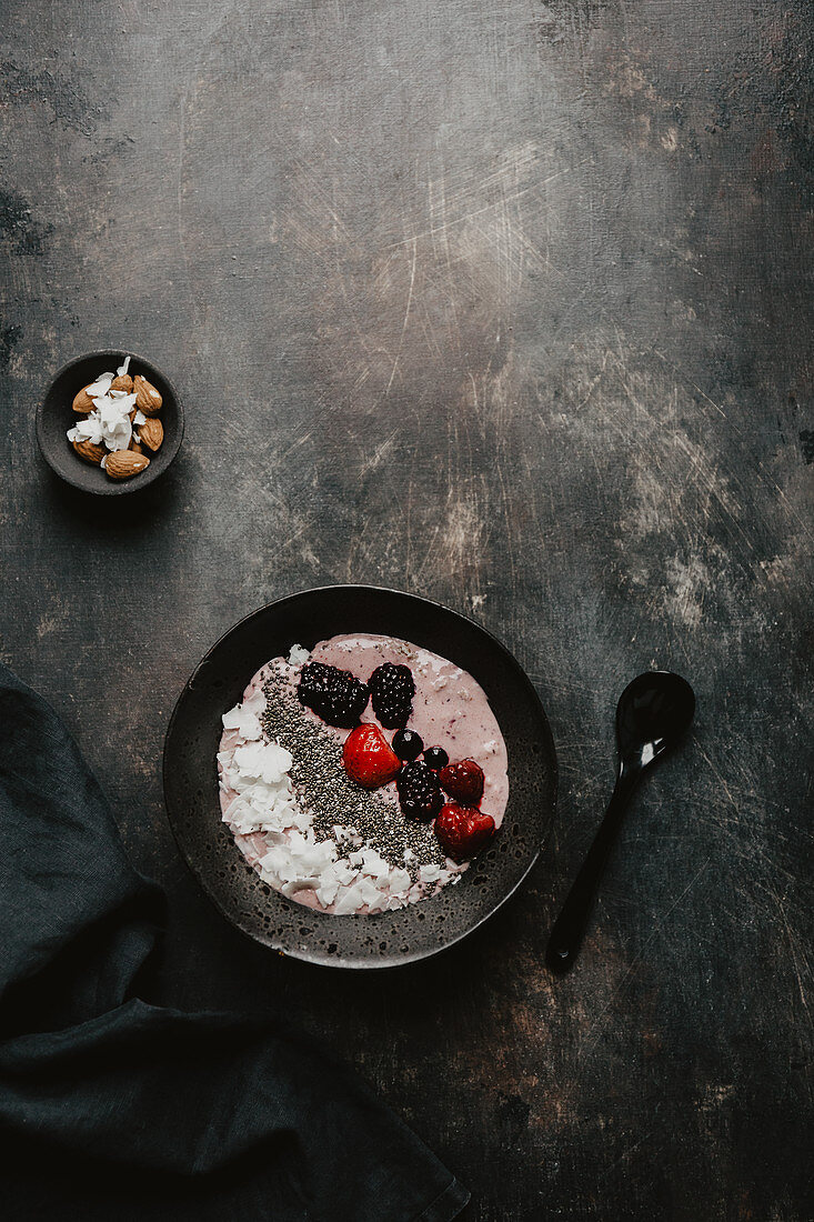 A smoothie bowl with berries and chia seeds