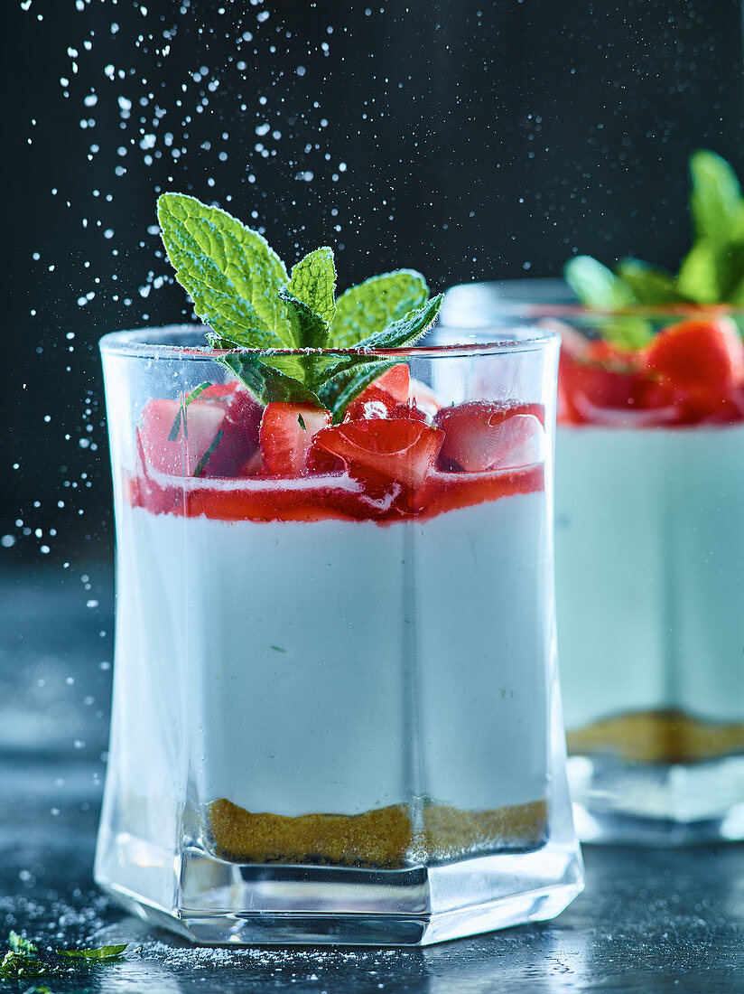 Strawberries and quark with mint in glasses