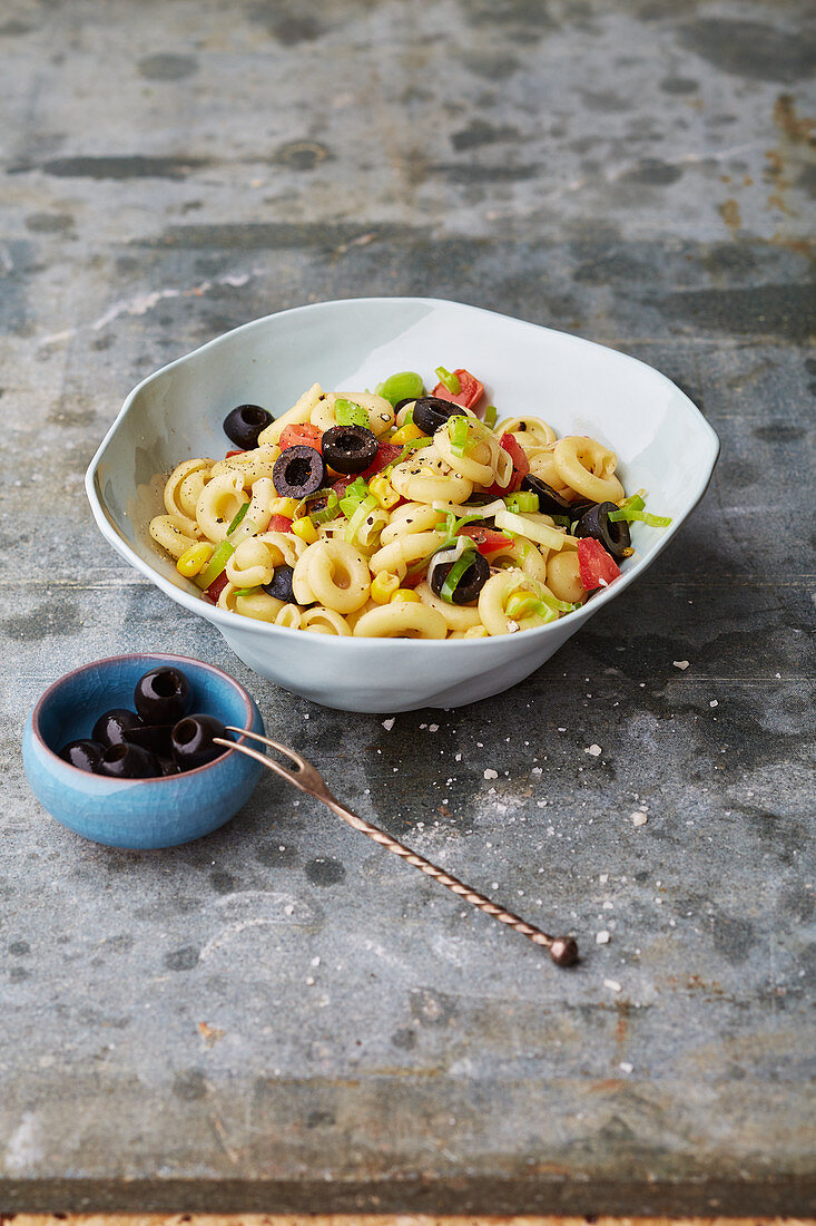Warm spanish pasta salad with olives