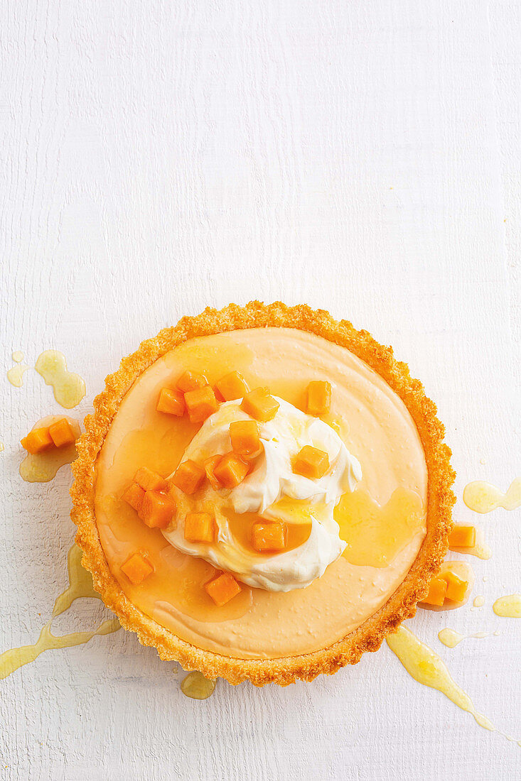Papaya and coconut tart with ginger syrup