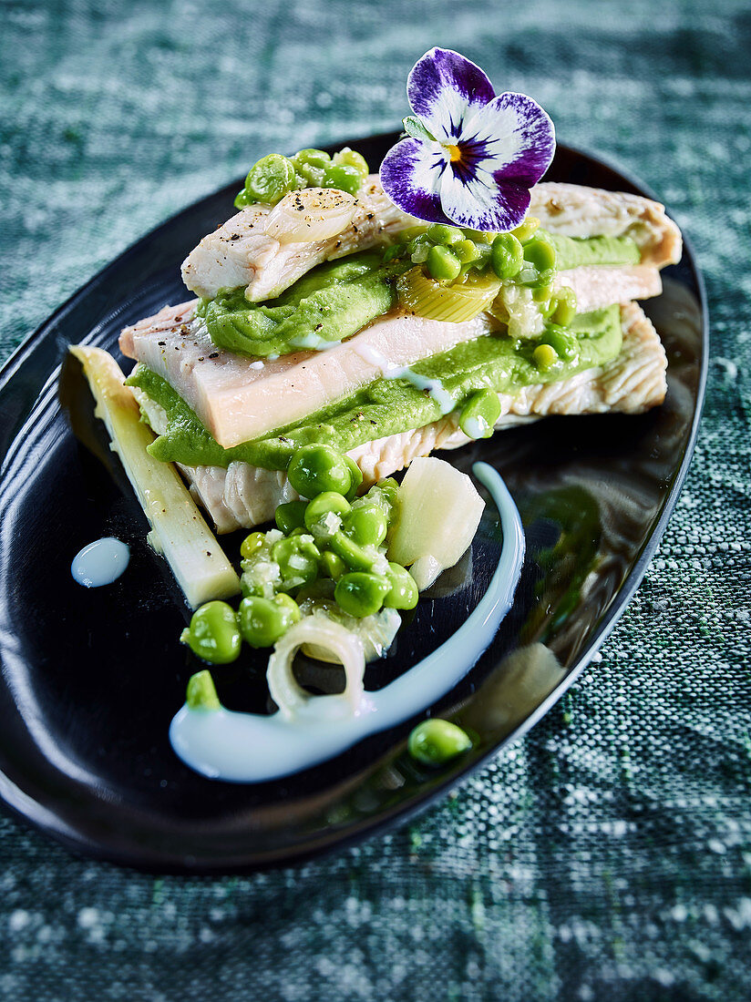 Turkey with pork belly, peas two ways, and asparagus