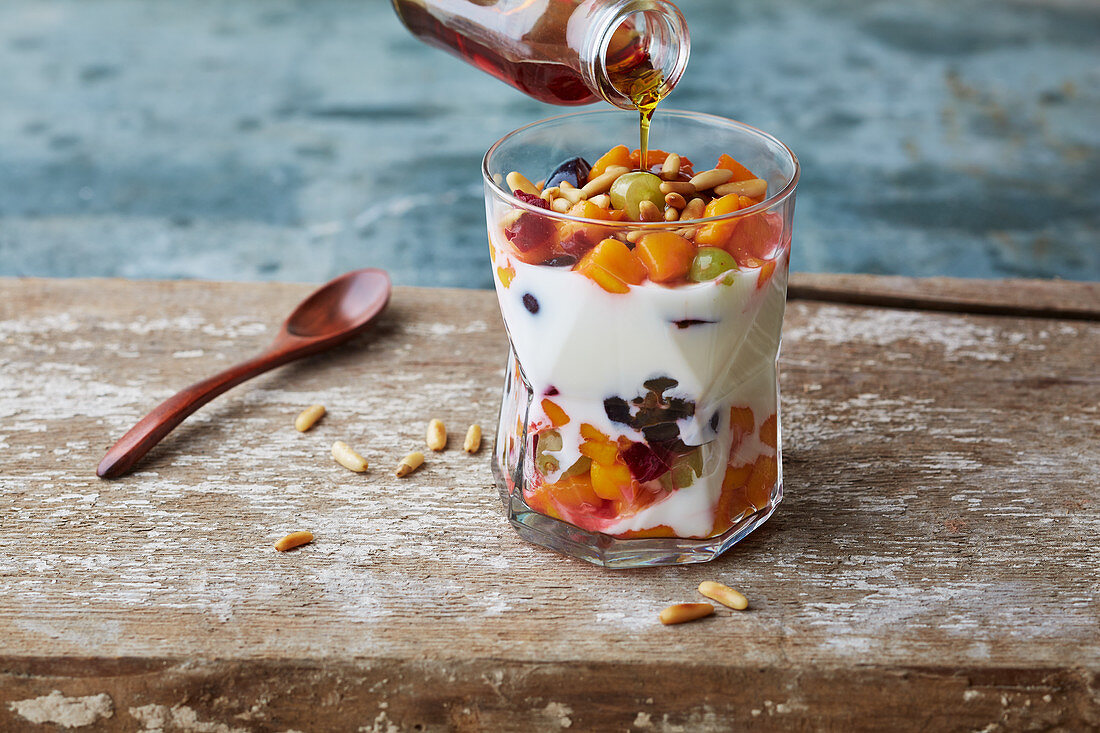 Yoghurt with fruit cocktail and maple syrup