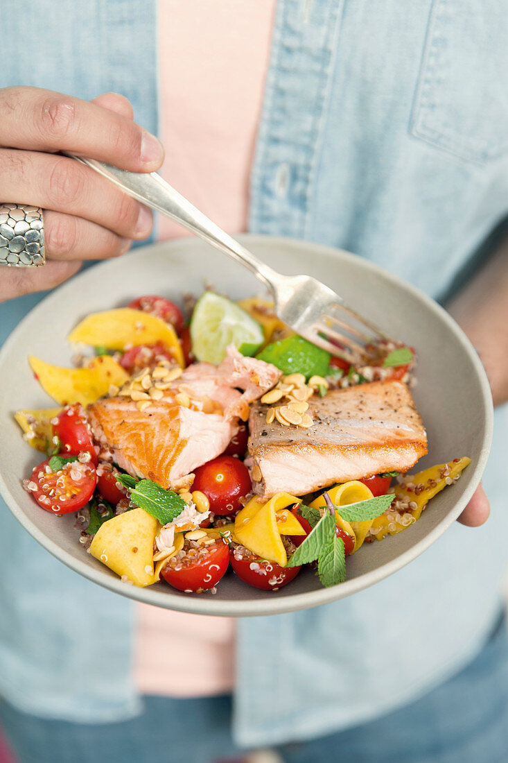Salmon fillet with a colourful quinoa salad and mango