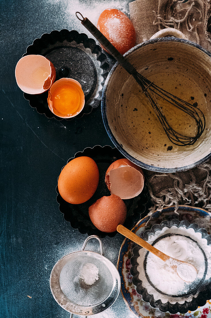 A still life with eggs and flour (top view)