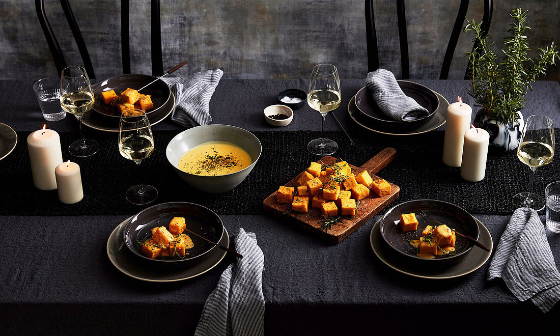 Crispy polenta fondue on a winter table setting