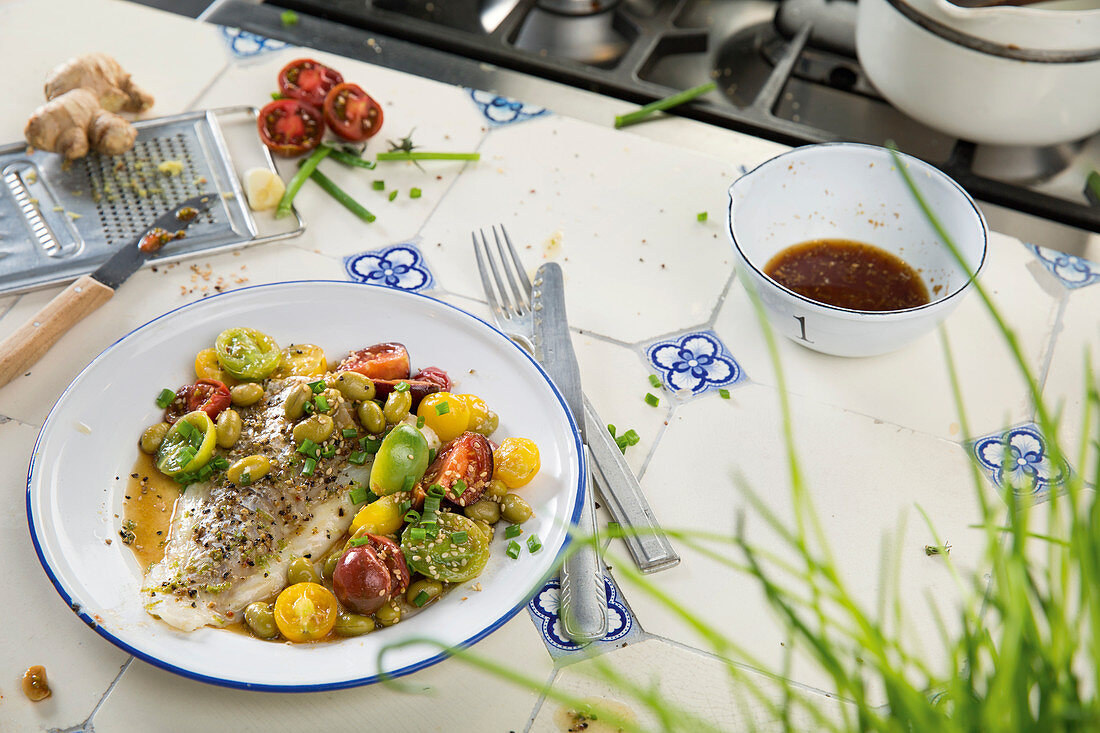 Cod with soya beans and tomatoes