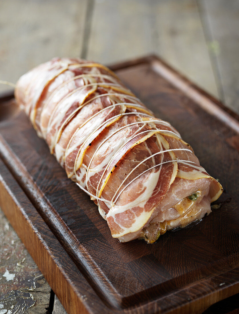 Raw, stuffed pork fillet wrapped in Parma ham (Tuscany)