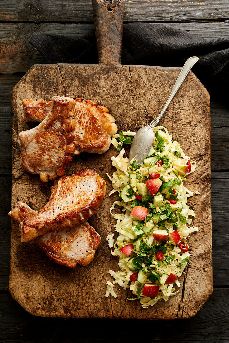 Pork chops with oriental apple and cabbage salad