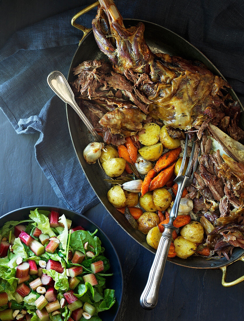 Roast lamb with potatoes, carrots, and spinach and rhubarb salad