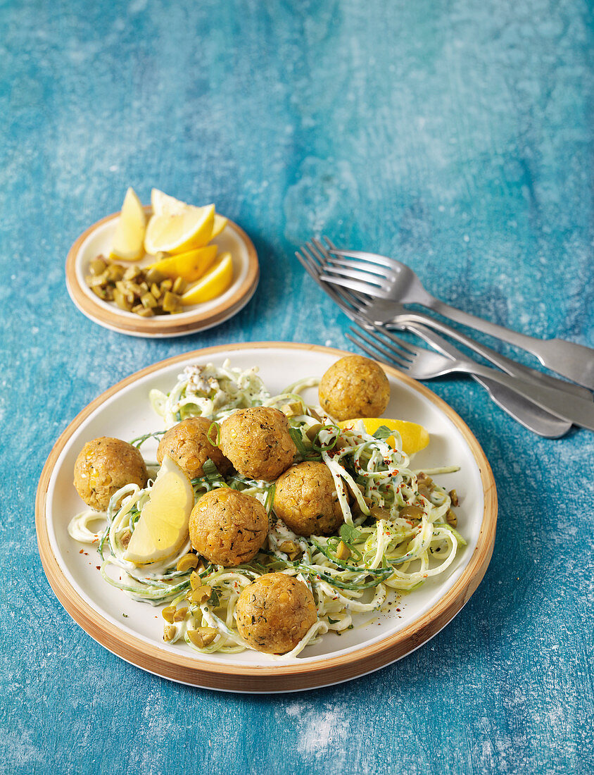 Lentil balls with garlic noodle nests