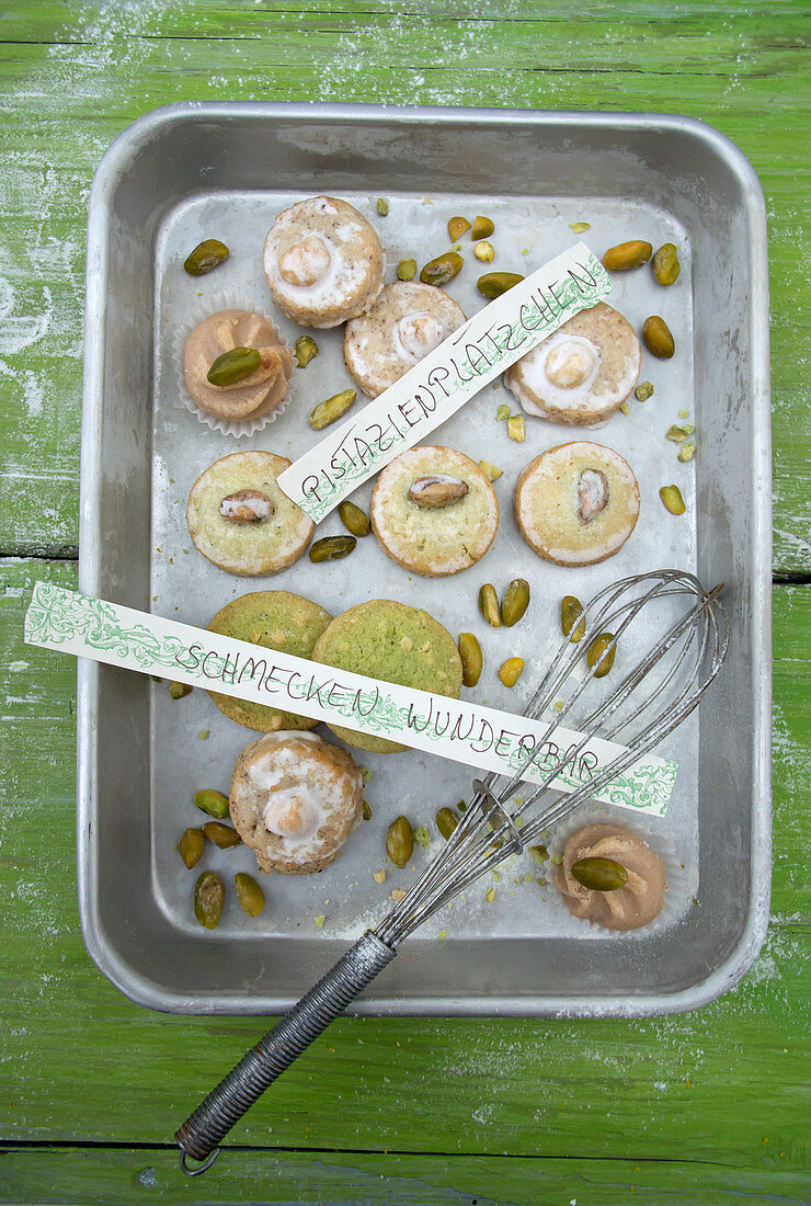Various pistachio biscuits in a metal tin