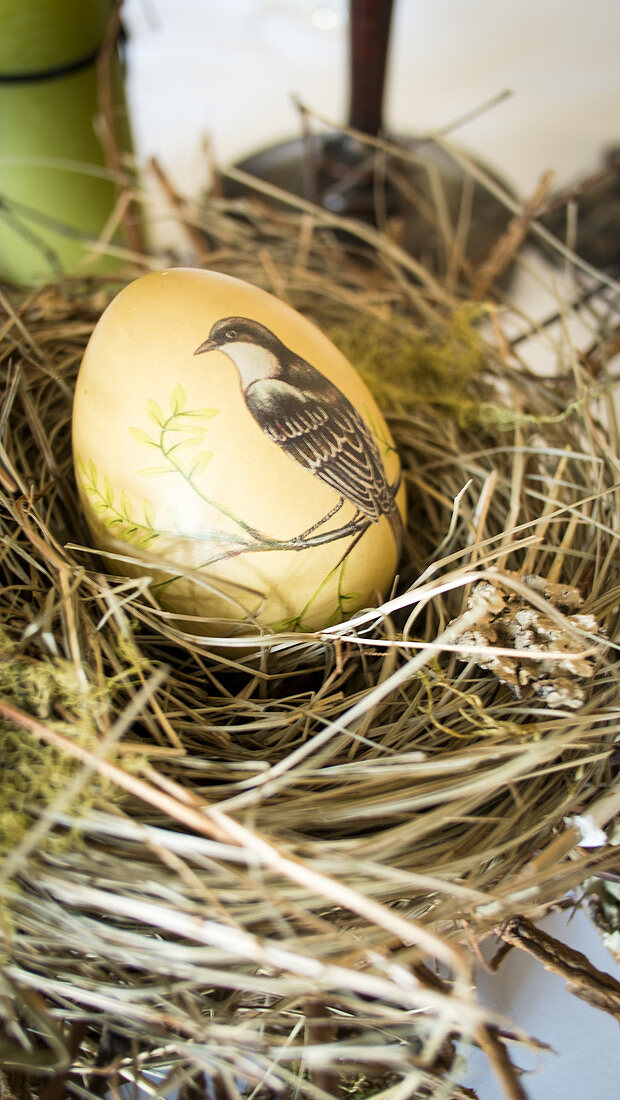 Painted egg in Easter nest