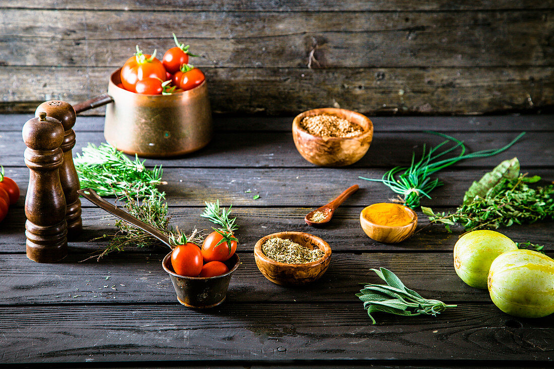 An arrangement of vegetables, herbs and spices