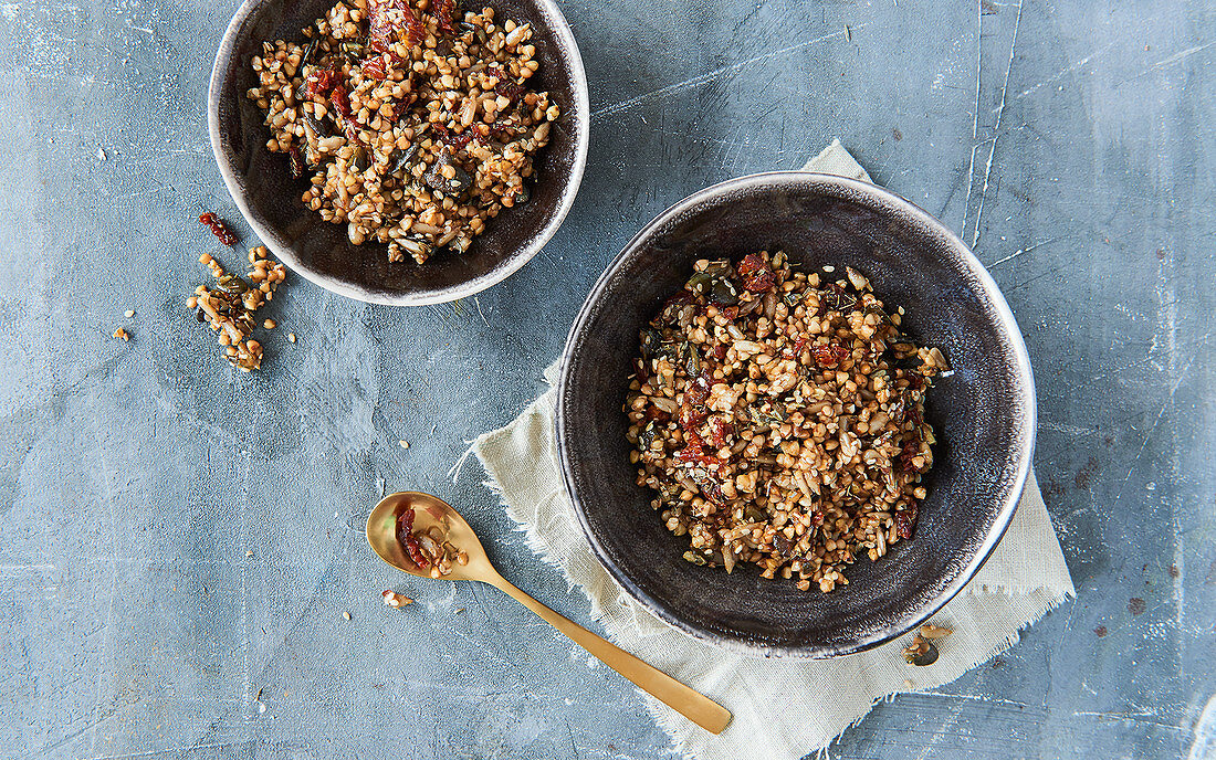 Salty granola with herbs and dried tomatoes