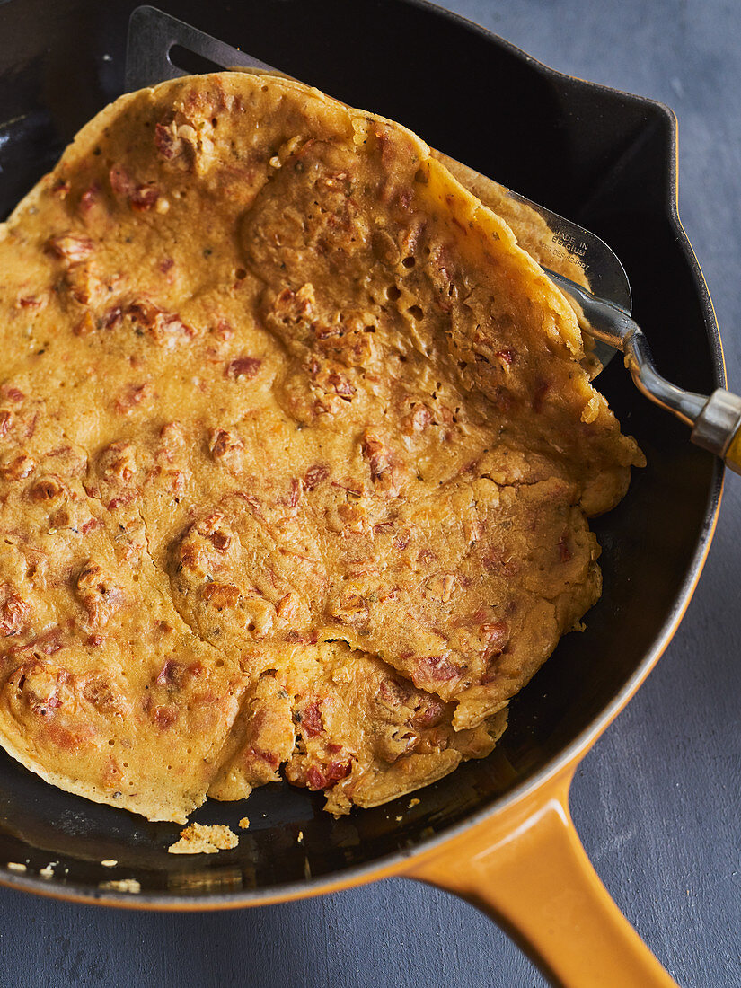 A bacon pancake in a pan