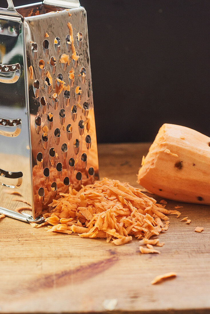 Sweet potatoes being grated